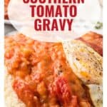 Close-up of Southern tomato gravy over biscuits with a fried egg, text overlay, and website URL at the bottom.