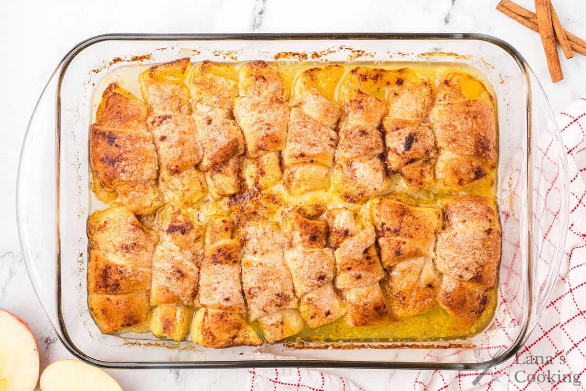 Finished dumplings in a baking pan.