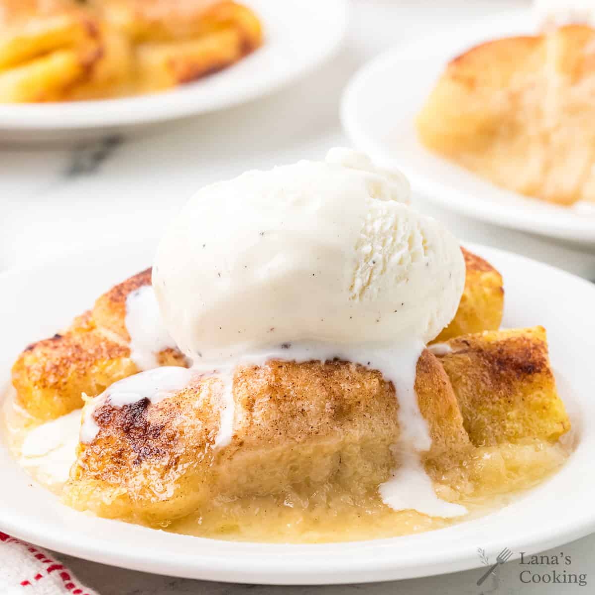 A serving of apple dumplings with a scoop of ice cream.