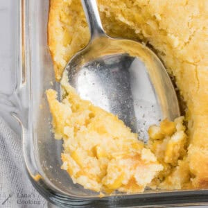 Finished corn souffle with a spoon dipped into it.