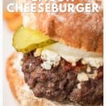 Close-up of a bacon cheeseburger with pickles and onions on a bun, text overlay at top and bottom.