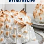 Baked Alaska dessert with golden peaks of meringue on a plate, text overlay reads Baked Alaska Retro Recipe.