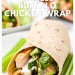 A grilled buffalo chicken wrap with lettuce and sauce, served with celery sticks on the side.