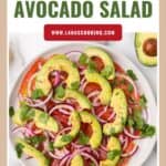 A plate of tomato, avocado, and red onion salad garnished with cilantro, with text overlay.