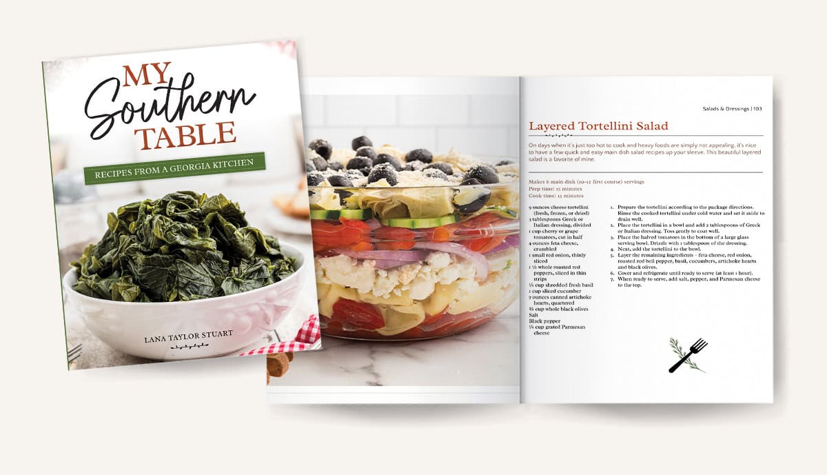 A cookbook titled My Southern Table and an open page showing a Layered Tortellini Salad recipe with an image of the salad in a glass bowl.