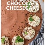 Top view of a no-bake chocolate cheesecake with whipped cream and mint leaves, text overlay promoting the recipe.