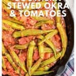Cast iron skillet filled with stewed okra and tomatoes, with a checkered cloth beside it.