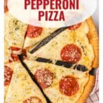 Close-up of a sliced homemade pepperoni pizza on a crust, with website www.lanascooking.com at the bottom.