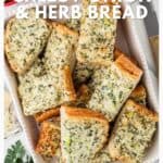 Cheesy onion and herb bread slices stacked on a white dish, garnished with fresh herbs.
