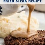 Gravy being poured over fried steak with mashed potatoes on a plate; recipe text at the top.