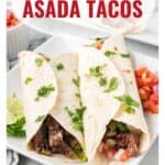Three carne asada tacos on a white plate, garnished with cilantro, with salsa and lime on the side.