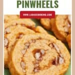 Close-up of sliced cheese pinwheels with pecans on a green surface, labeled Cheese Pinwheels.