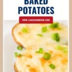Two cheesy twice-baked potato halves topped with sliced green onions on a white plate.