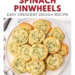 A plate of golden, spiral-shaped cheesy spinach pinwheels made with crescent dough.
