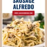 Plate of creamy pasta with sausage, garnished with herbs, labeled as Italian Sausage Alfredo.