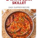 A skillet of Italian sausage with white beans and tomato sauce, garnished with parsley.