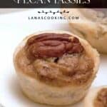 Close-up of mini Southern pecan tassies with a pecan half on top, displayed on a white plate.
