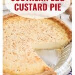 A Southern egg custard pie in a foil pan with a slice missing, topped with nutmeg.