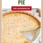 A sliced egg custard pie in a foil pan with a golden crust, sprinkled with nutmeg.