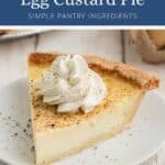 A slice of egg custard pie topped with whipped cream on a white plate.