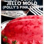 A bright pink raspberry jello mold sits on a silver platter with greenery, labeled as a vintage southern recipe.