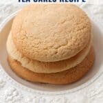Three stacked tea cakes on a white decorative plate with text about an old fashioned Southern tea cakes recipe.