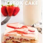 A slice of strawberry icebox cake topped with sliced strawberries, with a glass of milk and whole strawberries nearby.