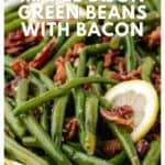 A plate of green beans with bacon pieces and a lemon slice, labeled Maple Dijon Green Beans with Bacon.
